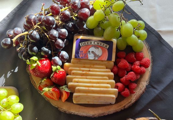 Image of Deer Creek Rattlesnake cheese available in our delis.